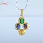 blue sapphire, yellow sapphire, emerald, and hessonite garnet pendant