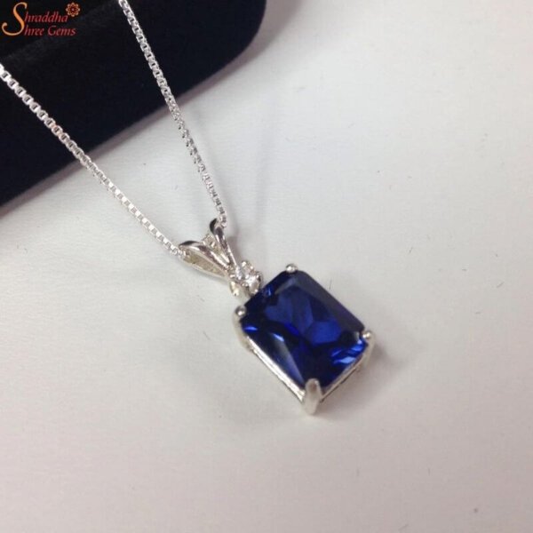 emerald shape blue sapphire pendant with moissanite